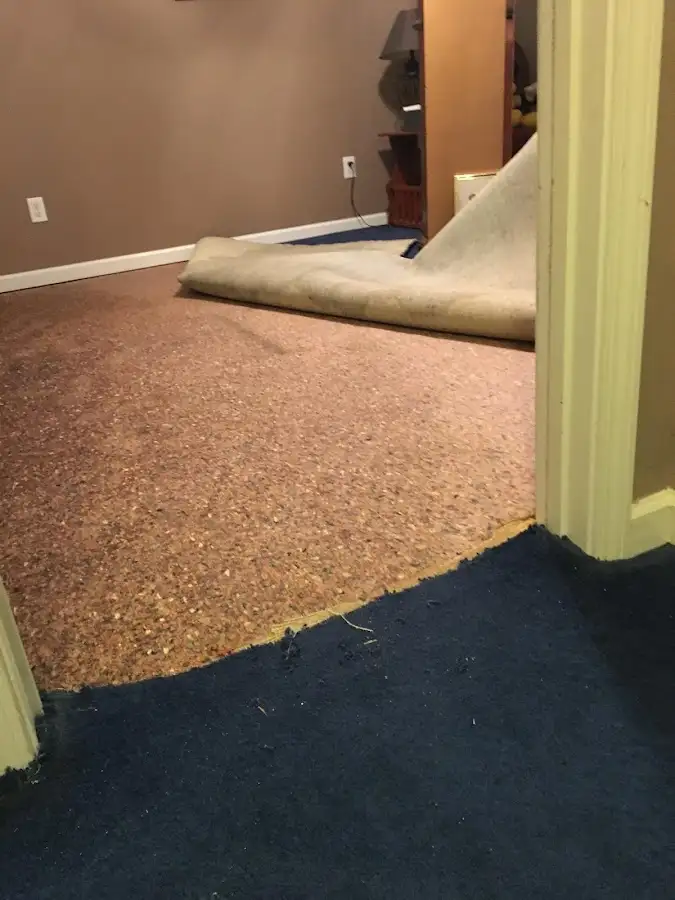 Carpet pad removal revealing water damage during Drying & Dehumidification in Colleyville